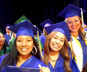 Three graduates at SJVC Bakersfield campus graduation ceremony