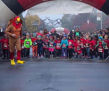 SJVC's Justin Reynolds volunteers to lead the kids race at Race Against Hunger