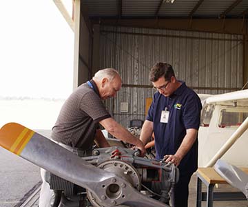 SJVC-aviation-maintenance-technology-student-working-on-airplane