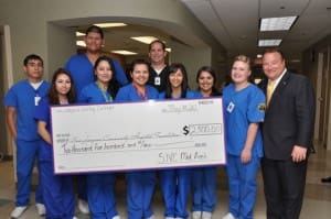 Bakersfield Hospital Employees Holding $2K Check