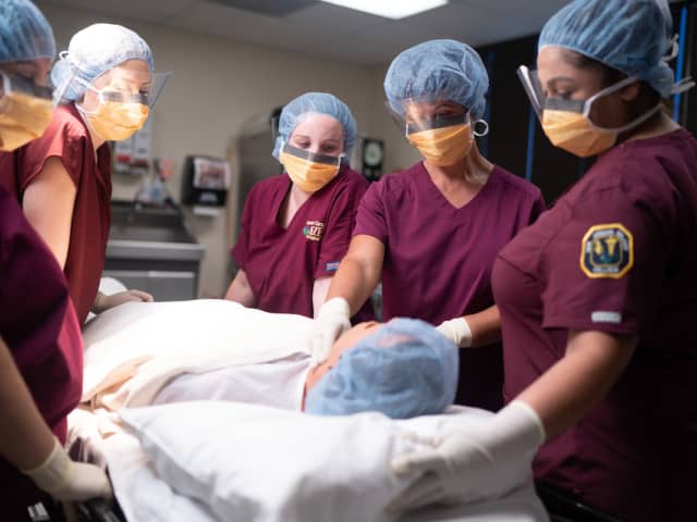 Students in Scrubs In an Operating Room