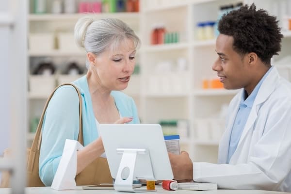 pharmacy technician and woman