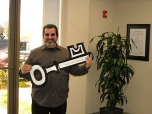 SJVC CEO Mike Perry Holding a Giant Key